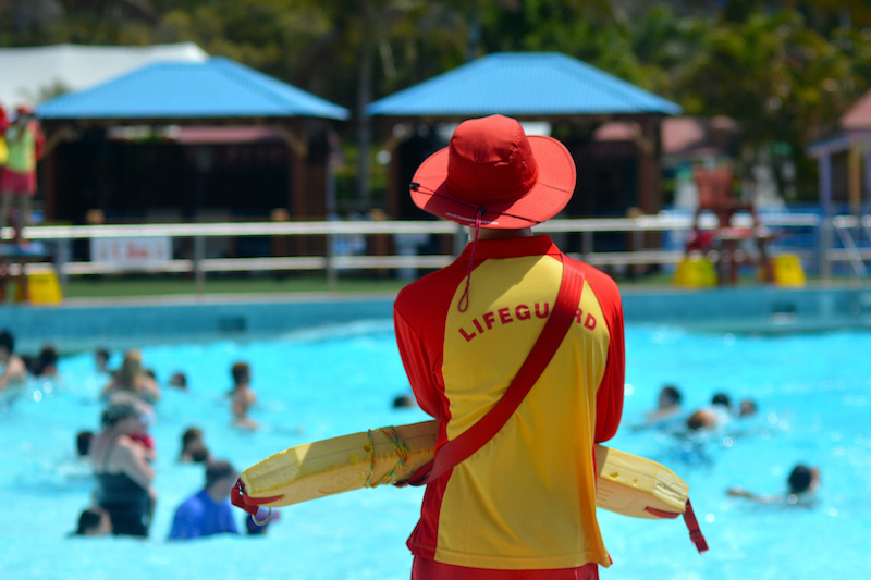 lifeguard watching kids in pool